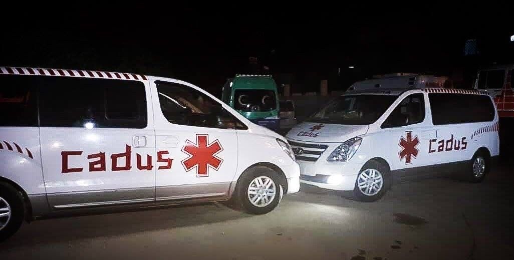 Ambulances financed by CADUS standing in a parking lot of Heyva Sor, ready for deployment.