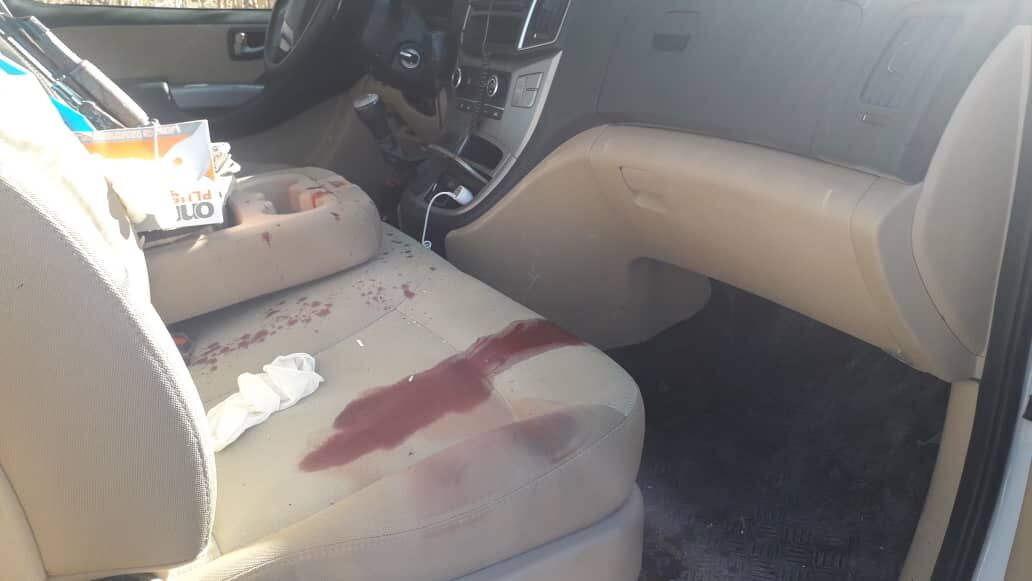 The bloody passenger seat in the damaged rescue vehicle.