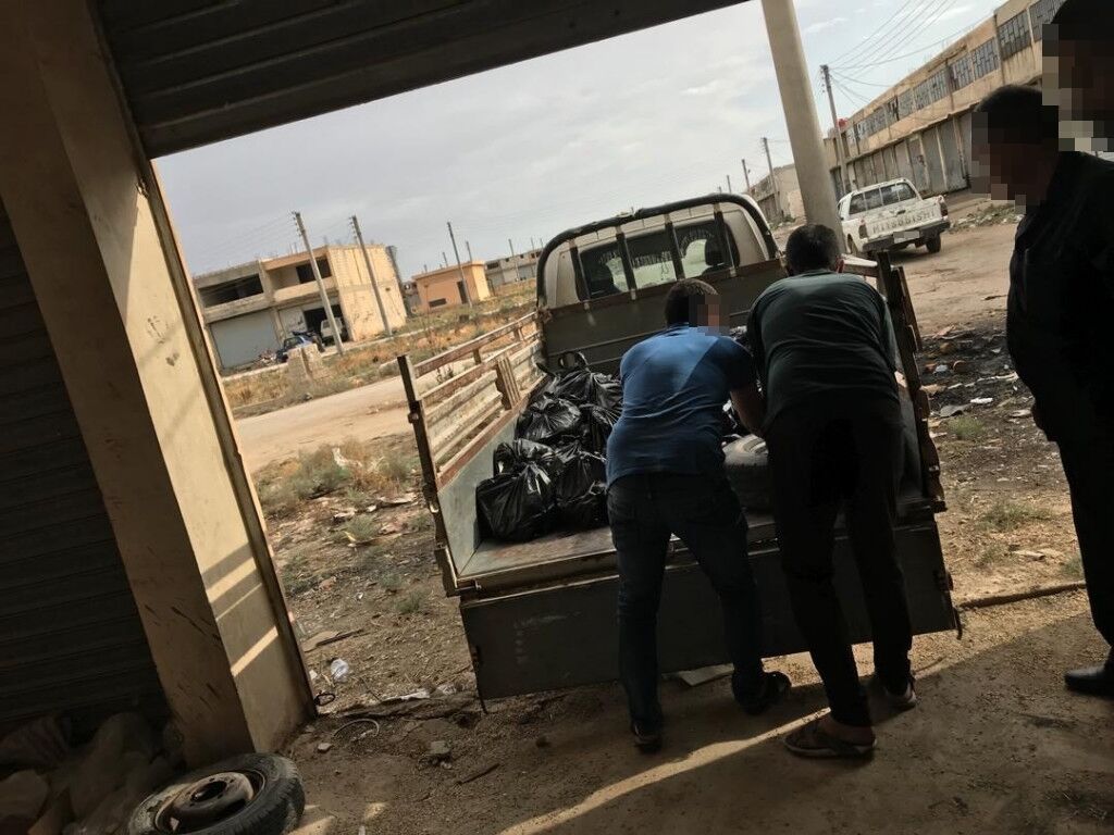 A truck is loaded with food supplies for distribution.